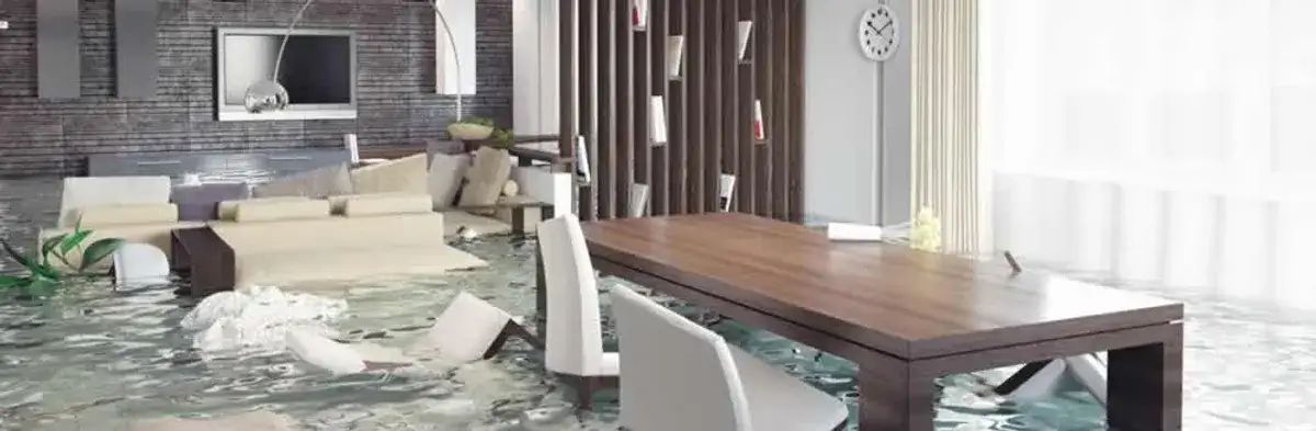 home interior affected by water damage with flooded floors and displaced furniture in Madison, WI